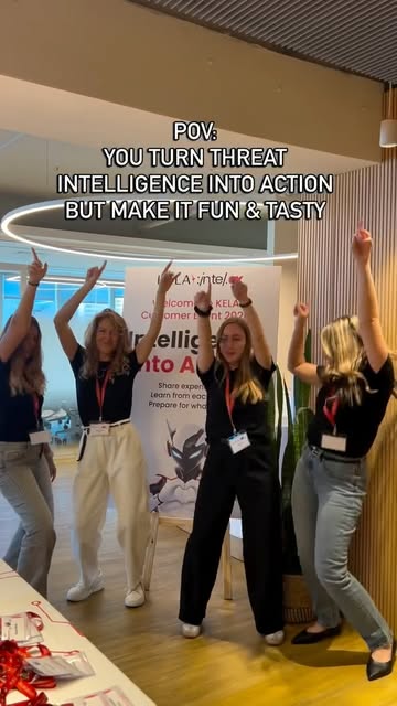 KELA team celebrating at the Intelligence into Action event